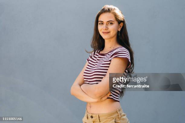 millennial mexican woman portrait - belly button stock pictures, royalty-free photos & images