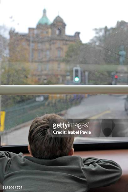 boy sightseeing edinburgh castle on bus. edinburgh, scotland - taxi boys stock pictures, royalty-free photos & images