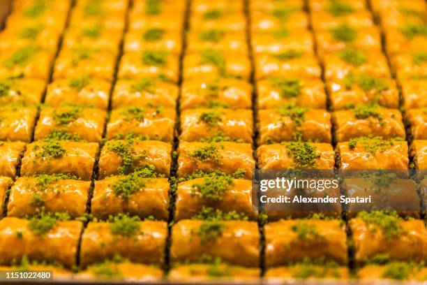 baklava with pistachio on a display - turkish delight stock pictures, royalty-free photos & images