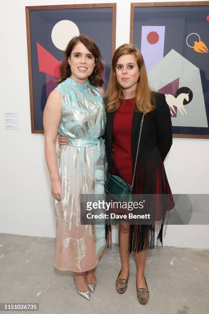Princess Eugenie of York and HRH Princess Beatrice of York at the Animal Ball Art Show Private Viewing, presented by Elephant Family on May 22, 2019...