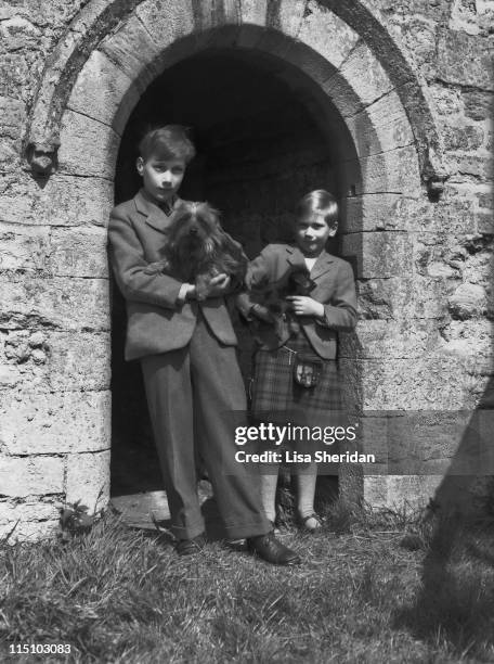 Prince William of Gloucester with his brother Prince Richard of Gloucester pictured with their dogs at their home at Barnwell Manor, Northamptonshire...