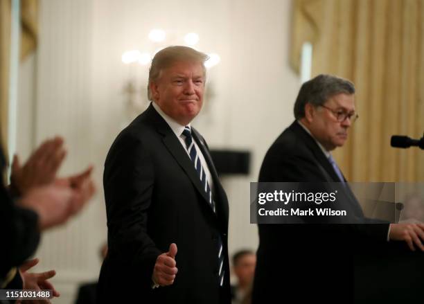 President Donald Trump stands with Attorney General William Barr before the presentation of the Public Safety Officer Medals of Valor in the East...