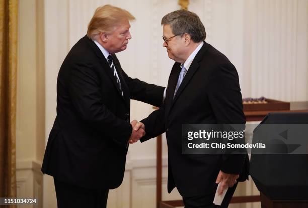 President Donald Trump shakes hands with Attorney General William Barr before presenting the Public Safety Officer Medal of Valor during a ceremony...
