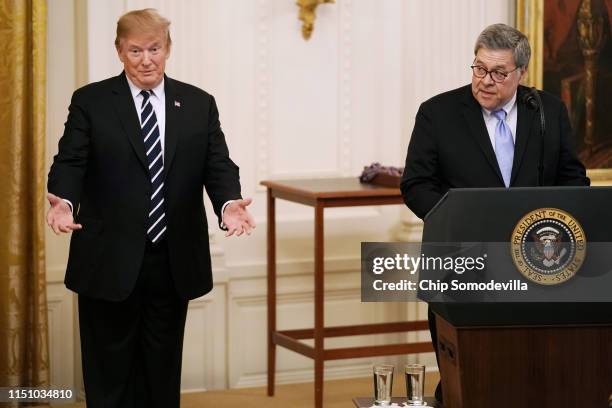 President Donald Trump listens to Attorney General William Barr during the Public Safety Officer Medal of Valor ceremony in the East Room of the...