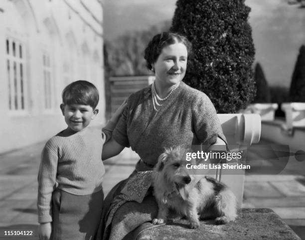 Queen Elizabeth The Queen Mother with her grandson Prince Charles on the patio of the Royal Lodge in Windsor, England on April 07, 1954.