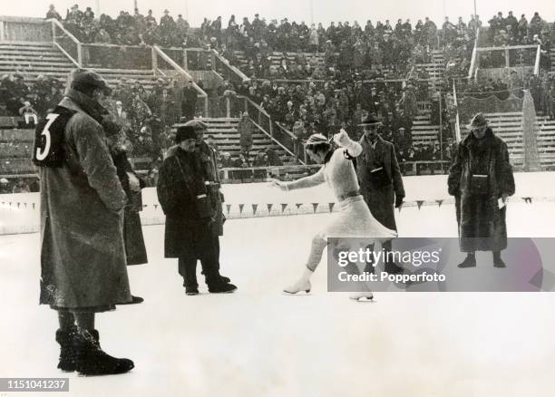 Louise Weigel of the United States being judged in the women's figure skating competition during the Winter Olympic Games in Garmisch-Partenkirchen,...