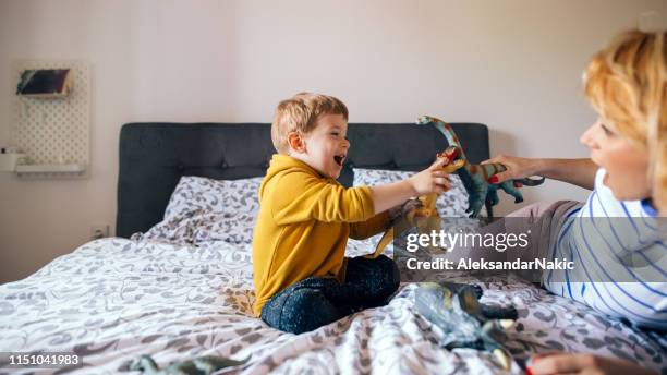 dino fight in our bedroom - toy animal stock pictures, royalty-free photos & images