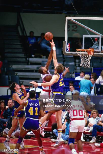 Mark Eaton of the Utah Jazz blocks a shot against the LA Clippers on November 10, 1987 at the Los Angeles Memorial Sports Arena in Los Angeles,...