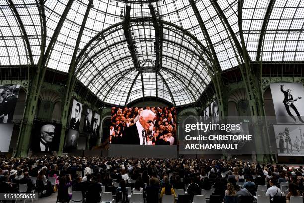 People attend the "Karl For Ever" event to honour late German fashion designer Karl Lagerfeld at the Grand Palais in Paris, on June 20, 2019. - The...