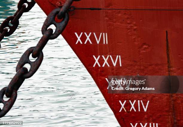 bow, anchor chains and depth markers on an old sailing ship - ironclad stock pictures, royalty-free photos & images