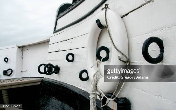 life preserver and rigging hooks on an old sailing ship - ironclad stock pictures, royalty-free photos & images