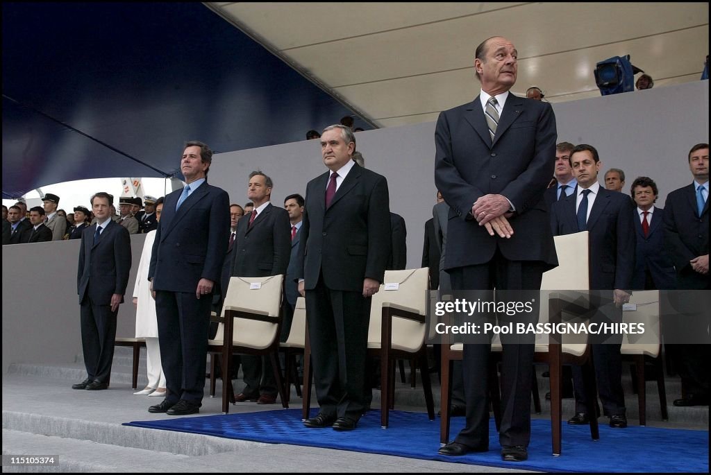 President Jacques Chirac And Members Of The French Government Attend French National Day Ceremonies In The Presidential Stand In Paris, France On July 14, 2002.