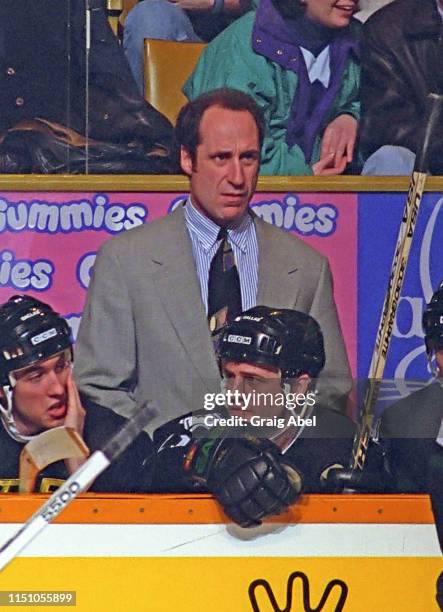 Head Coach Bob Gainey of the Dallas Stars watches the play against the Toronto Maple Leafs during NHL game action on March 8, 1995 at Maple Leaf...