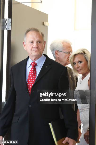 Roy Moore and wife, Kayla, enter a press conference to announce his plans to run for U.S. Senate in 2020 on June 20, 2019 in Montgomery, Alabama....