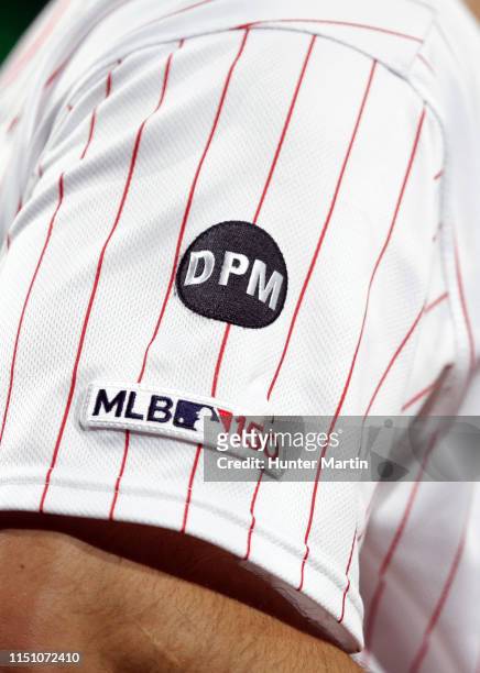 Player of the Philadelphia Phillies wears a patch commemorating the life of former Phillies executive David Montgomery during a game against the...