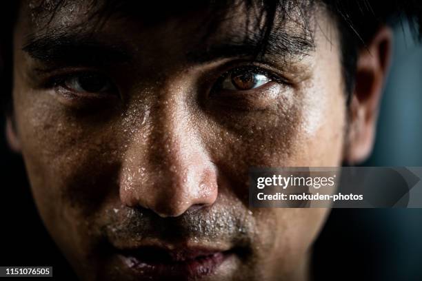 portrait of a man doing sports training - fighter portraits stock pictures, royalty-free photos & images