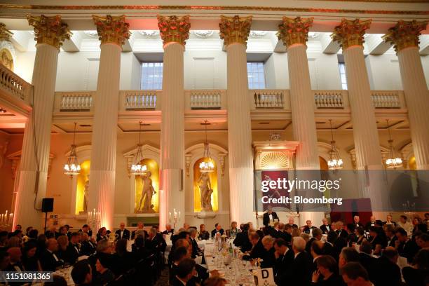 Attendees listen as Philip Hammond, U.K. Chancellor of the exchequer, center, speaks during the annual Bankers and Merchants Dinner at The Mansion...