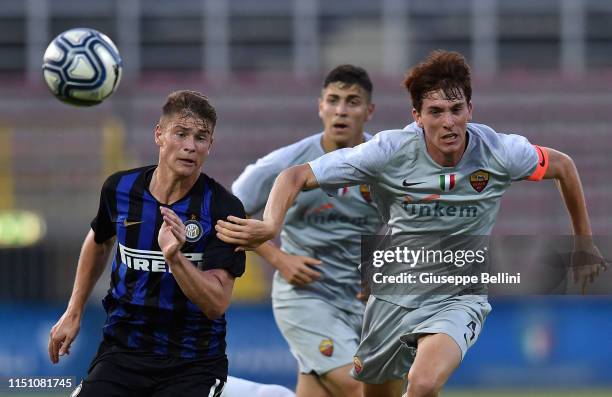 Player of AS Roma and player of FC Internazionale in action during the U17 league final match between FC Internazionale and As Roma at Stadio Bruno...