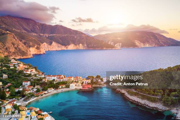 sunset view of asos village on the west coast of kefalonia, greece, europe. aerial view - asos stock pictures, royalty-free photos & images