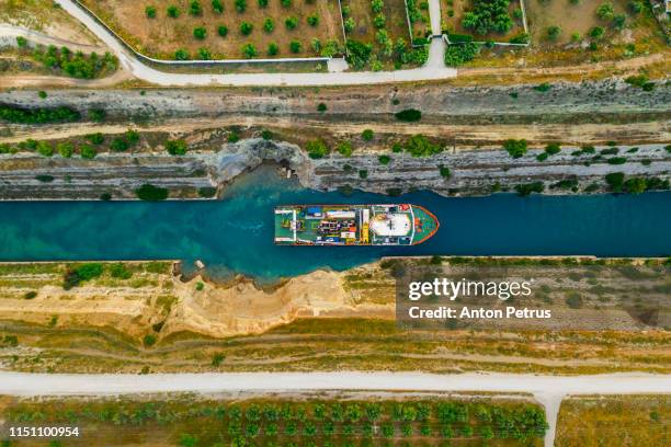 ship passing through corinth canal in greece - fauces stock pictures, royalty-free photos & images