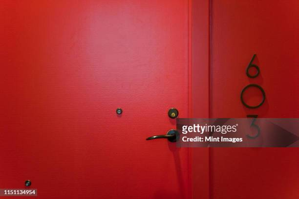 red door - looking through hole stock pictures, royalty-free photos & images