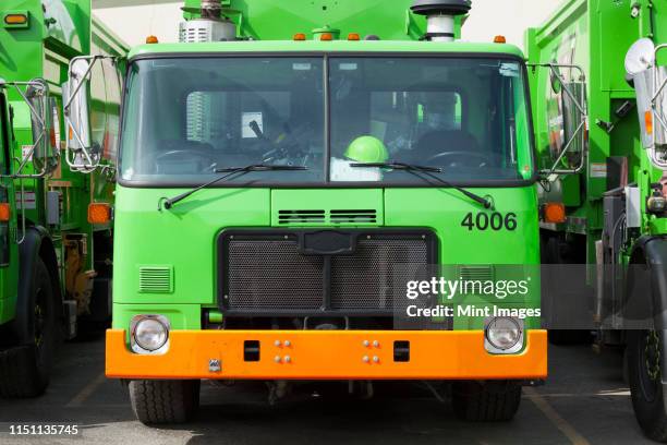 garbage truck fleet - garbage truck stock pictures, royalty-free photos & images