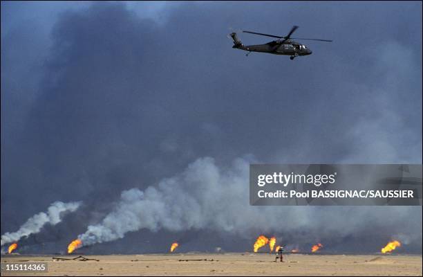 Kuwait after Iraqi occupation on February 28, 1991 - Oil fields on fire on the road from Kuwait City to Basrah, US soldiers.