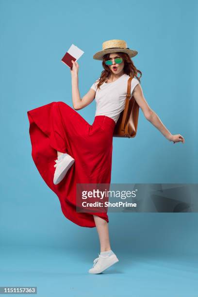 girl jumping from happiness and going on a journey with a backpack - lady hut studio stock-fotos und bilder