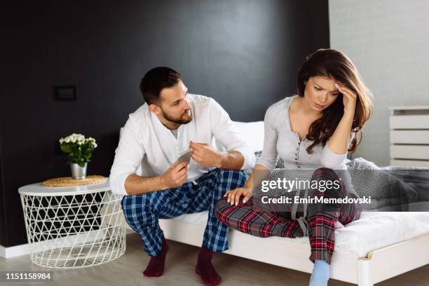 young couple having problems in their relationship - cheating wives stock pictures, royalty-free photos & images