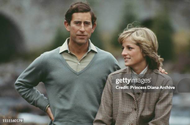 Princess Diana, Princess of Wales and Prince Charles, Prince of Wales, on their honeymoon in Balmoral by the River Dee, August 1981; Diana is wearing...