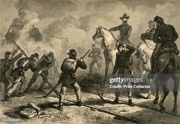 Sherman's March to the Sea', . Unionist Major General William Tecumseh Sherman's men sabotaging a railrway during a military campaign of the American...