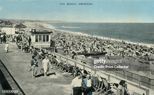 The Beach, Aberdeen', 1961. Crowds on the seafront at Aberdeen in Scotland. [E. T. W. Dennis & Sons, Ltd., London and Scarborough]. Artist Unknown.