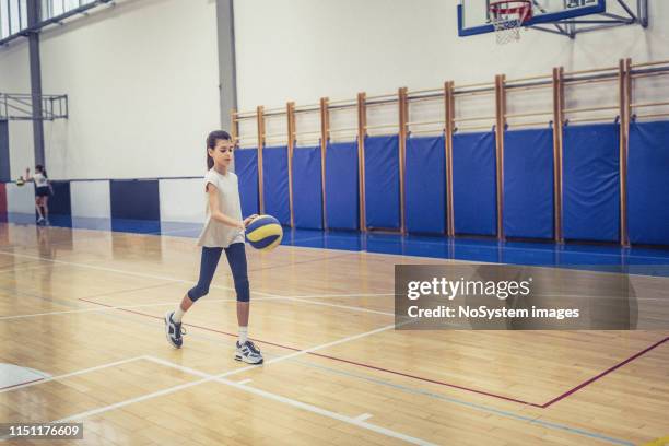 cute girl on volleyball training - girls volleyball stock pictures, royalty-free photos & images