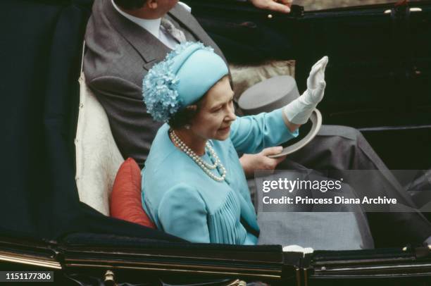 Queen Elizabeth II in a carriage during the wedding of Prince Charles and Lady Diana Spencer, London, 29th July 1981.