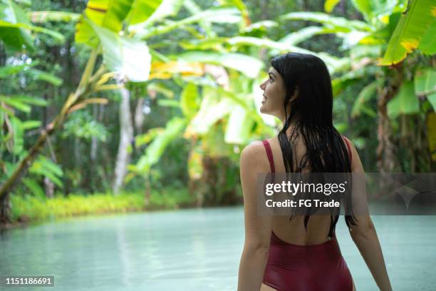 woman exploring the fervedouro in tocantins, brazil - tocantins stock pictures, royalty-free photos & images