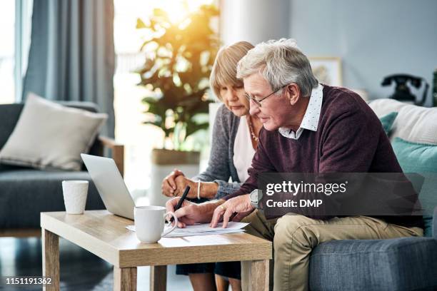 household finances don't manage themselves - financial planning seniors stock pictures, royalty-free photos & images