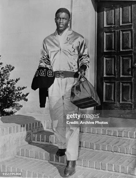 American baseball player Jackie Robinson during his time with UCLA, Los Angeles, California, circa 1940. He is wearing the UCLA team jacket and...