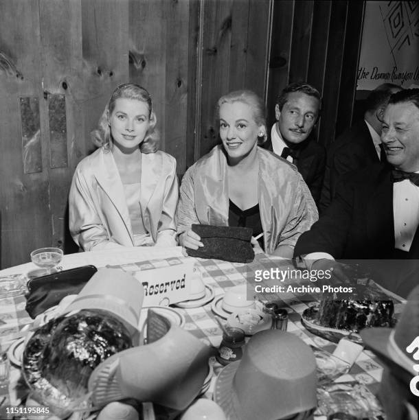 From left to right, actress Grace Kelly, Faye Emerson, Oleg Cassini and restauranteur Bernard 'Toots' Shor at a party for the Damon Runyon Theater at...