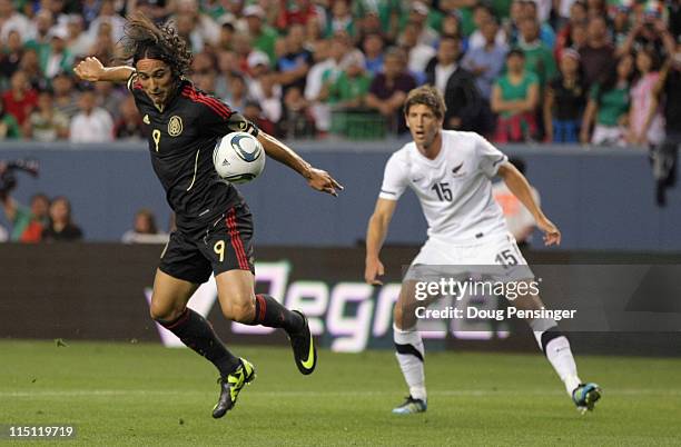 Aldo de Nigris of Mexico controls the ball against Andrew Boyens of New Zealand at INVESCO Field at Mile High on June 1, 2011 in Denver, Colorado....