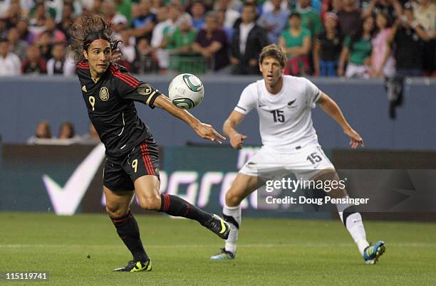 Aldo de Nigris of Mexico controls the ball against Andrew Boyens of New Zealand at INVESCO Field at Mile High on June 1, 2011 in Denver, Colorado....