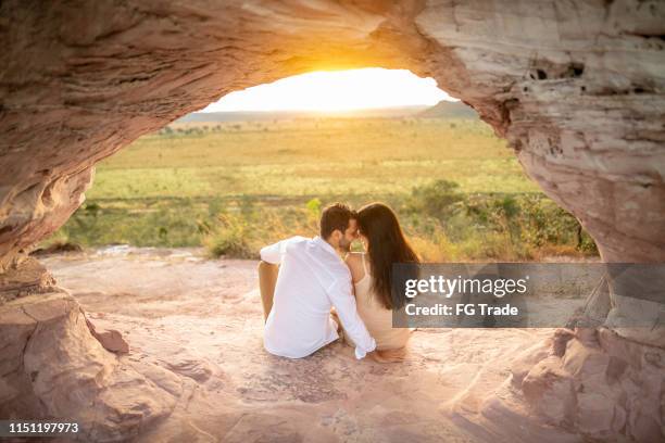 rear view of a couple sitting during a sunset in pedro furada inside the jalapão state park, tocantins - love you stock pictures, royalty-free photos & images