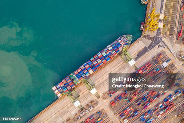 top view of international port with crane loading containers in import export business logistics. - singapore city aerial stock pictures, royalty-free photos & images