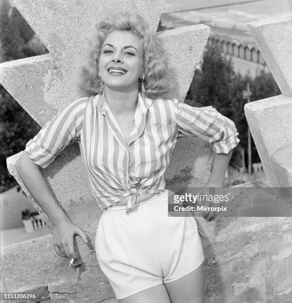 Venice Film Festival, Friday 31st August 1956; pictured is Italian actress Sandra Milo, wearing striped shirt and white shorts.