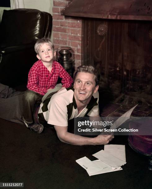 American actor Kirk Douglas with his son Michael Douglas, circa 1950.