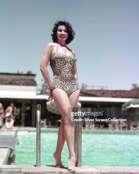 Argentine-American actress Linda Cristal in a leopard print swimsuit, circa 1965.