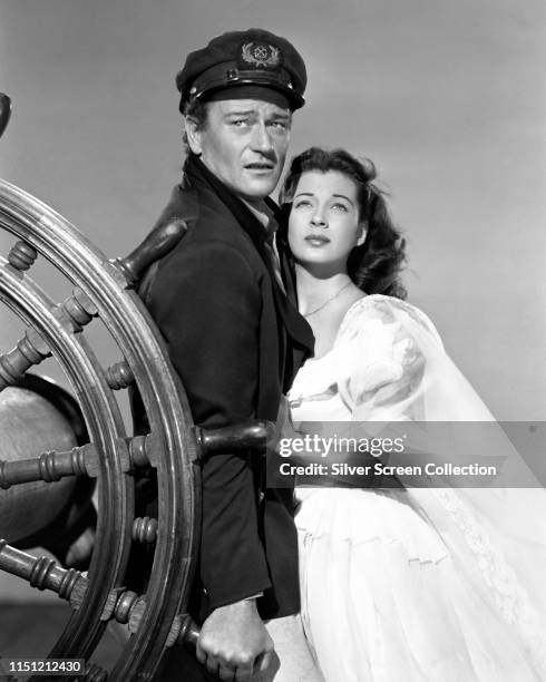 Actors John Wayne as Captain Ralls and Gail Russell as Angelique Desaix in the film 'Wake of the Red Witch', 1948.