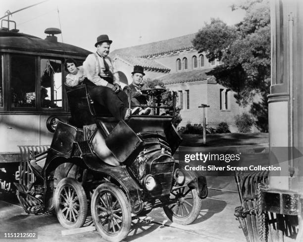 Comedy duo Oliver Hardy and Stan Laurel in a scene from the comedy film 'Hog Wild', 1930.