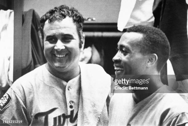 Tow heroes in Minnesota's 8-6 win over the Oakland A's in 18 innings, Ron Perranoski, )L), and Cesar Tovar appear on the clubhouse following the...