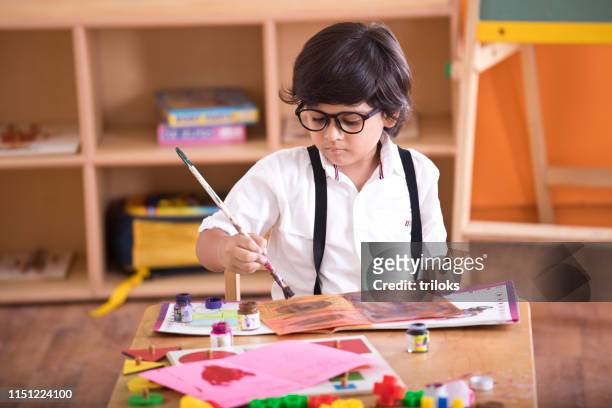 indian boy drawing - craft stock pictures, royalty-free photos & images