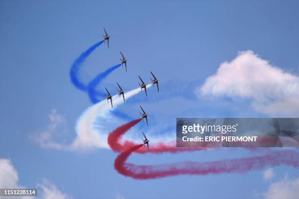 French elite acrobatic flying team "Patrouille de France" perform a flying display at the International Paris Air Show on June 21 at Le Bourget...